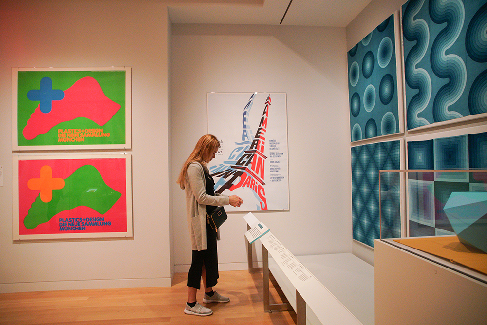 woman viewing pictures in a museum