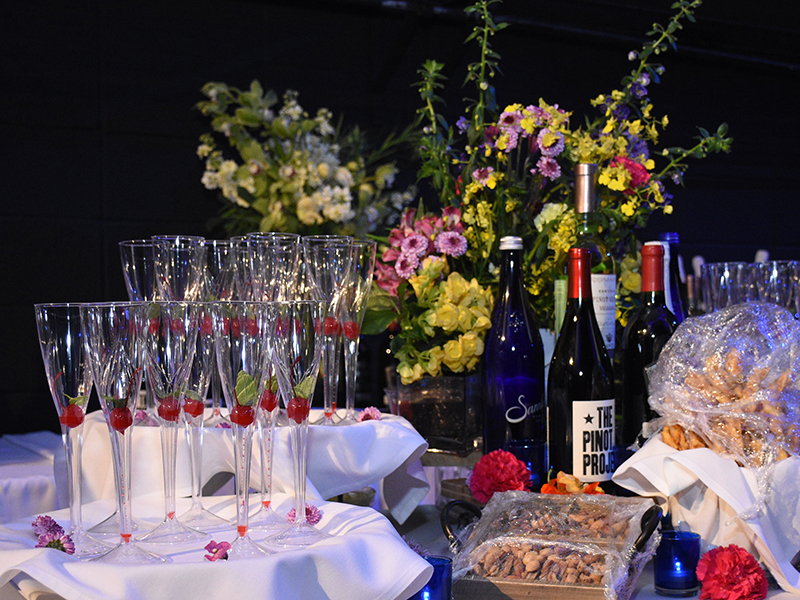 Cocktail glasses, wine bottles and flowers