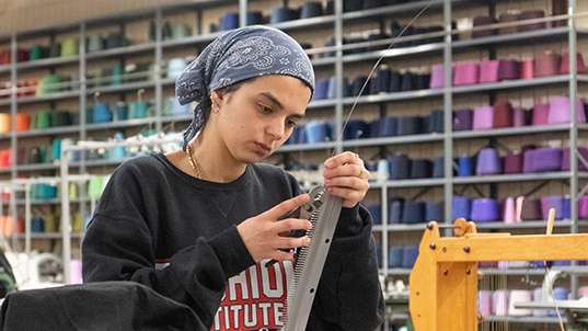 FIT student working with textiles