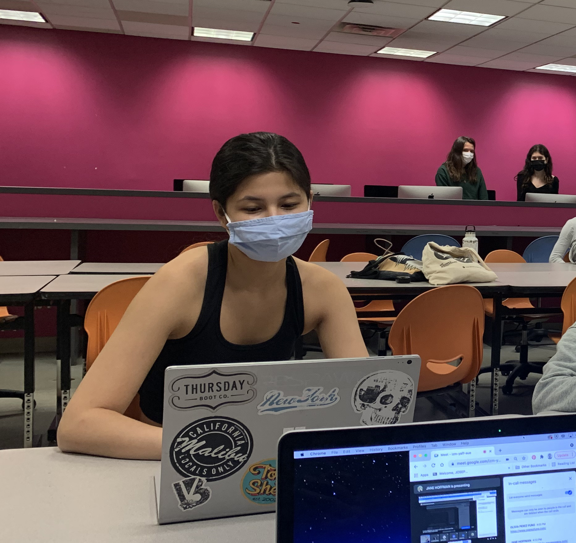 student at her computer on conference call 