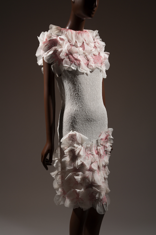 white sheer short sleeveless tube dress with 3-D pink tie dyed rosettes